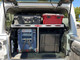 Aluminum cargo rack shown here with Fridge slide and gear in a Jeep Wrangler JL