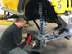 The GenRight tech installing the Alcon brakes on a Jeep