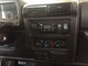 Shown Installed in a Jeep Wrangler TJ on a black GenRight radio plate